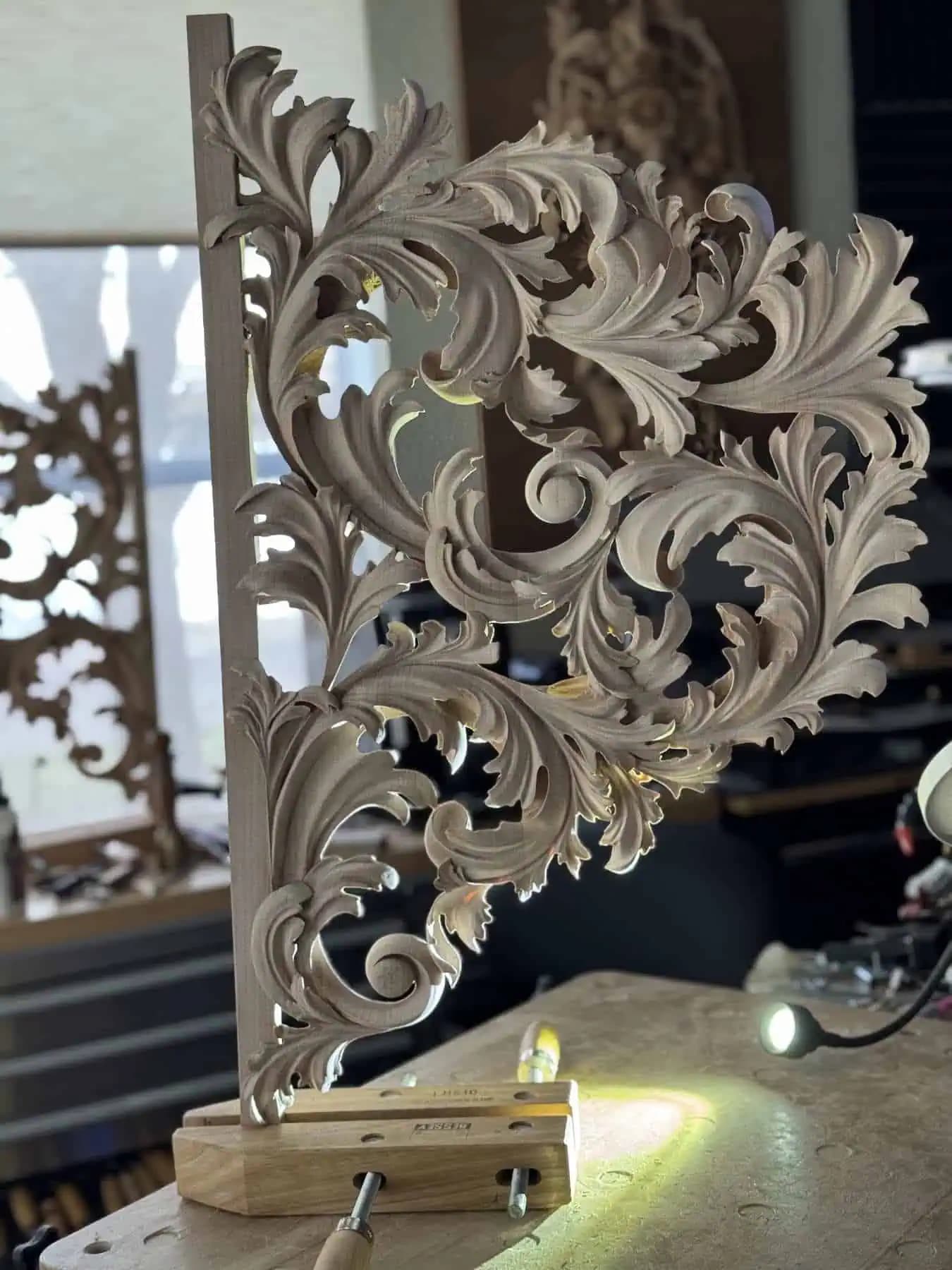 Pierced Acanthus Pipe Organ Shade Pipe organ shade with flowing acanthus scrollwork, a custom wood carving by Alexander Grabovetskiy clamped at the bench.