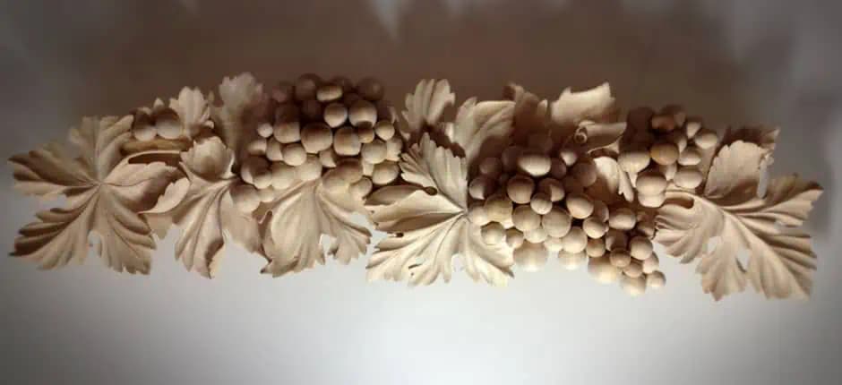 Carved Grape Clusters and Vine Leaves Limewood grape clusters and vine leaves in deep relief, a custom wood carving by Alexander Grabovetskiy.