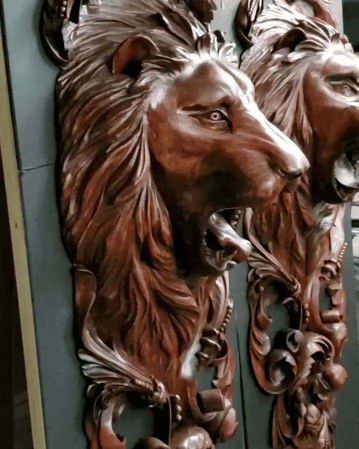 Carved Lion Head High Relief Panels Lion heads with flowing manes in high-relief limewood, a custom wood carving by Alexander Grabovetskiy.