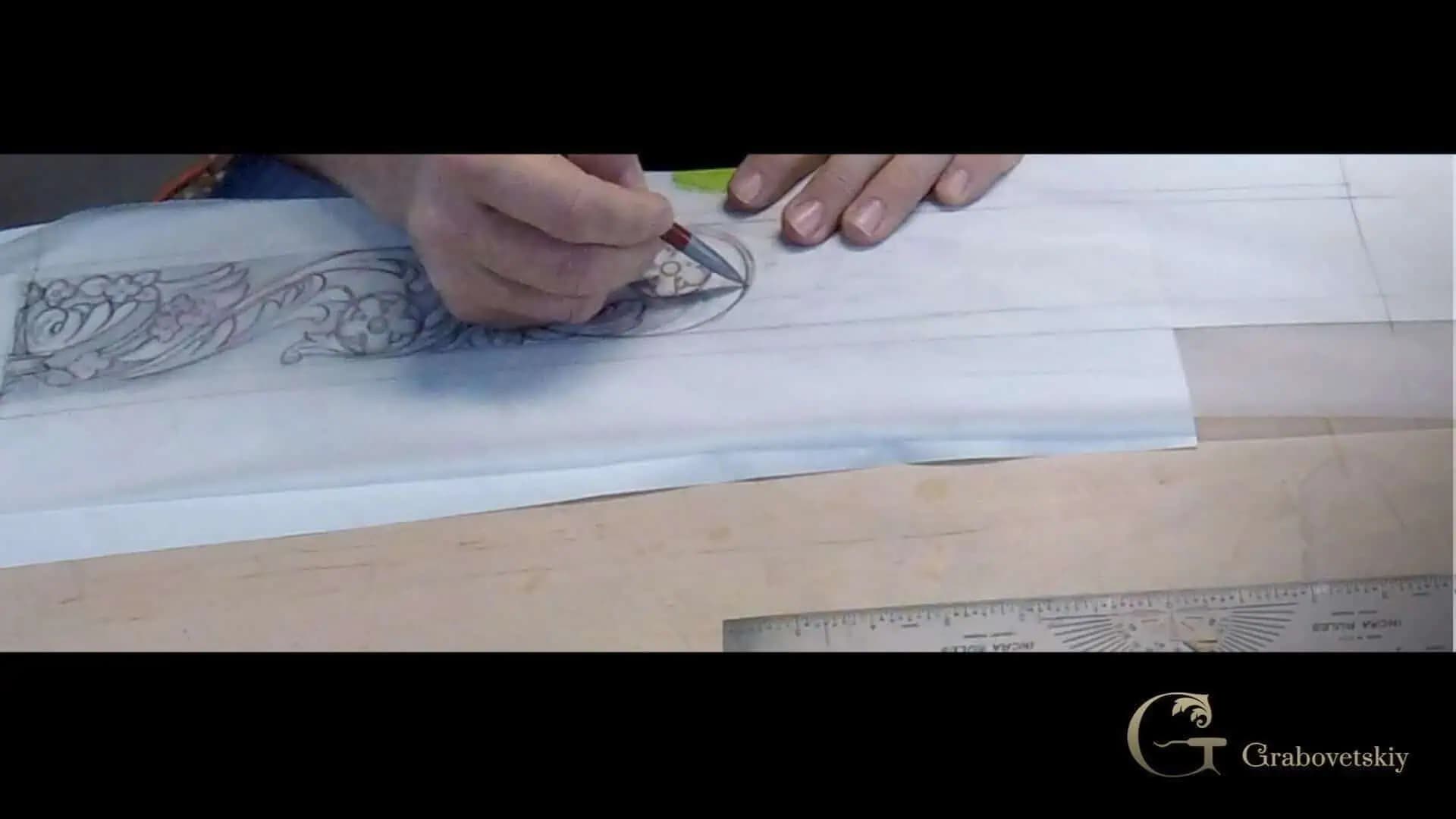Ornamental Acanthus Scroll Design Drawing Alexander Grabovetskiy drawing an acanthus scroll pattern on paper, preparing a custom wood carving design.