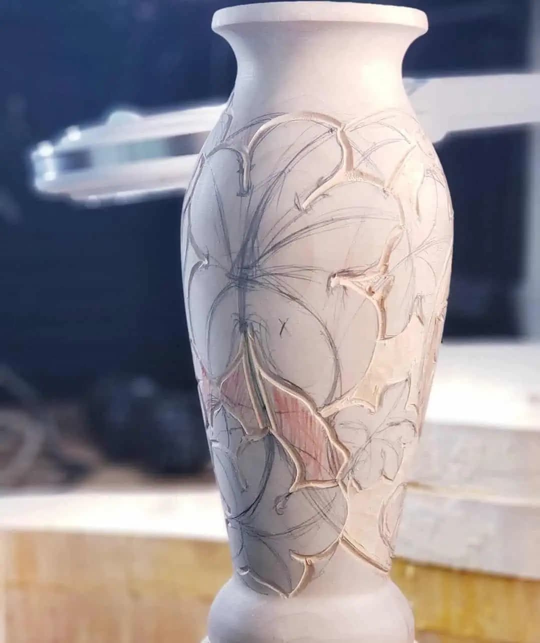 Carved Limewood Vase with Lily Motif Limewood vase carved with lilies in progress by Alexander Grabovetskiy, a custom wood carving piece.