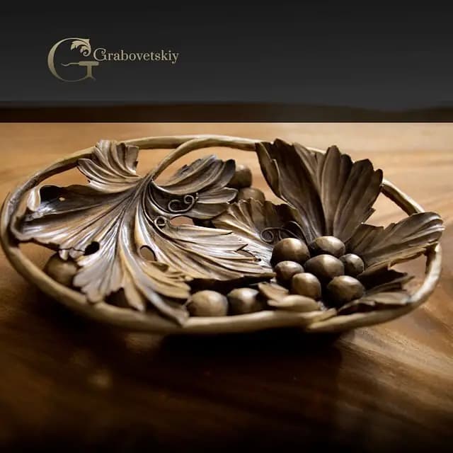 Carved Grape and Leaf Dish Limewood dish carved with grape clusters and leaves by Alexander Grabovetskiy, a custom wood carving.