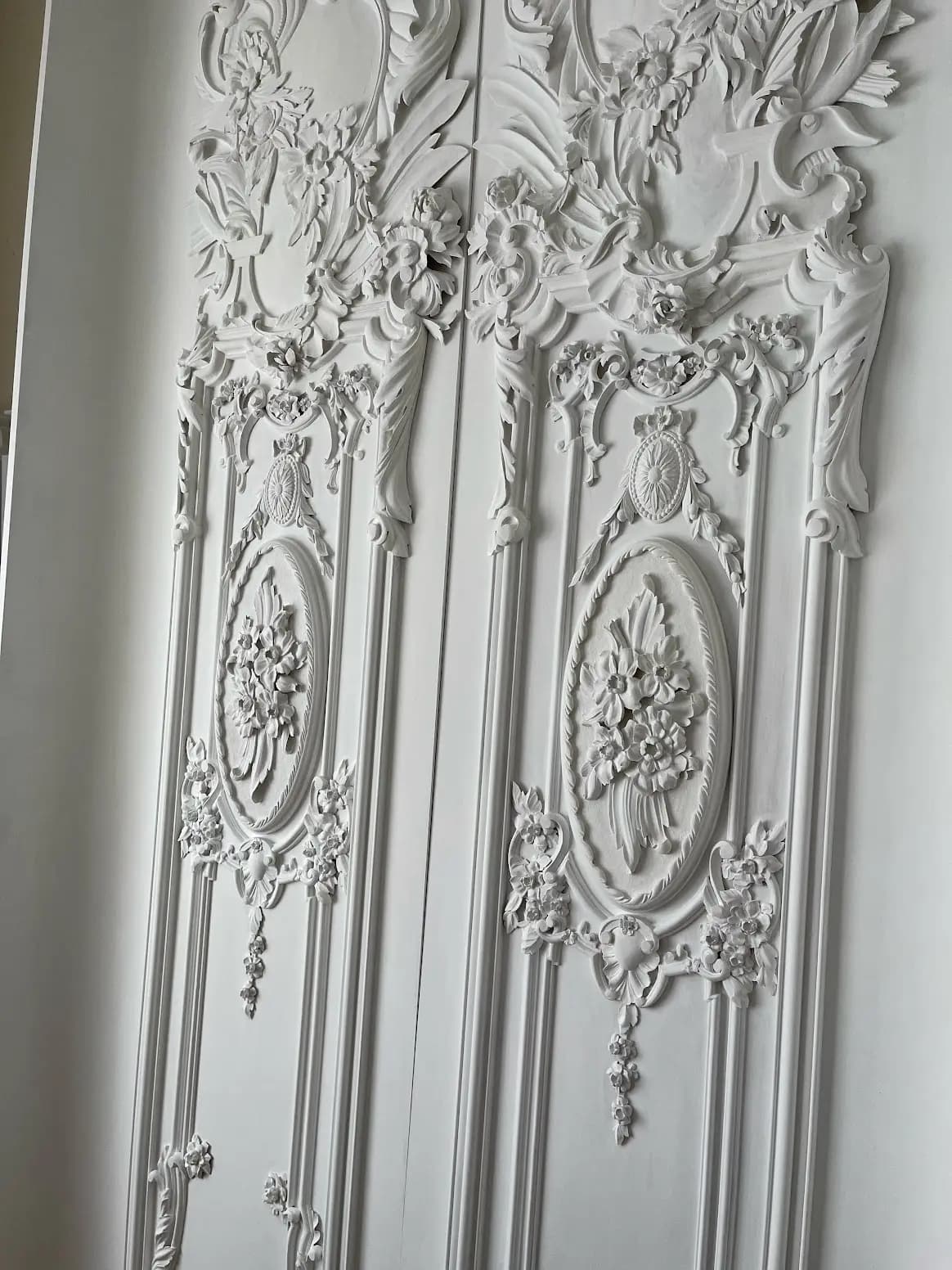 Rococo Floral Wall Panel Carving Ornate white carved wall panels with floral medallions and acanthus scrolls by Alexander Grabovetskiy, custom wood carving.
