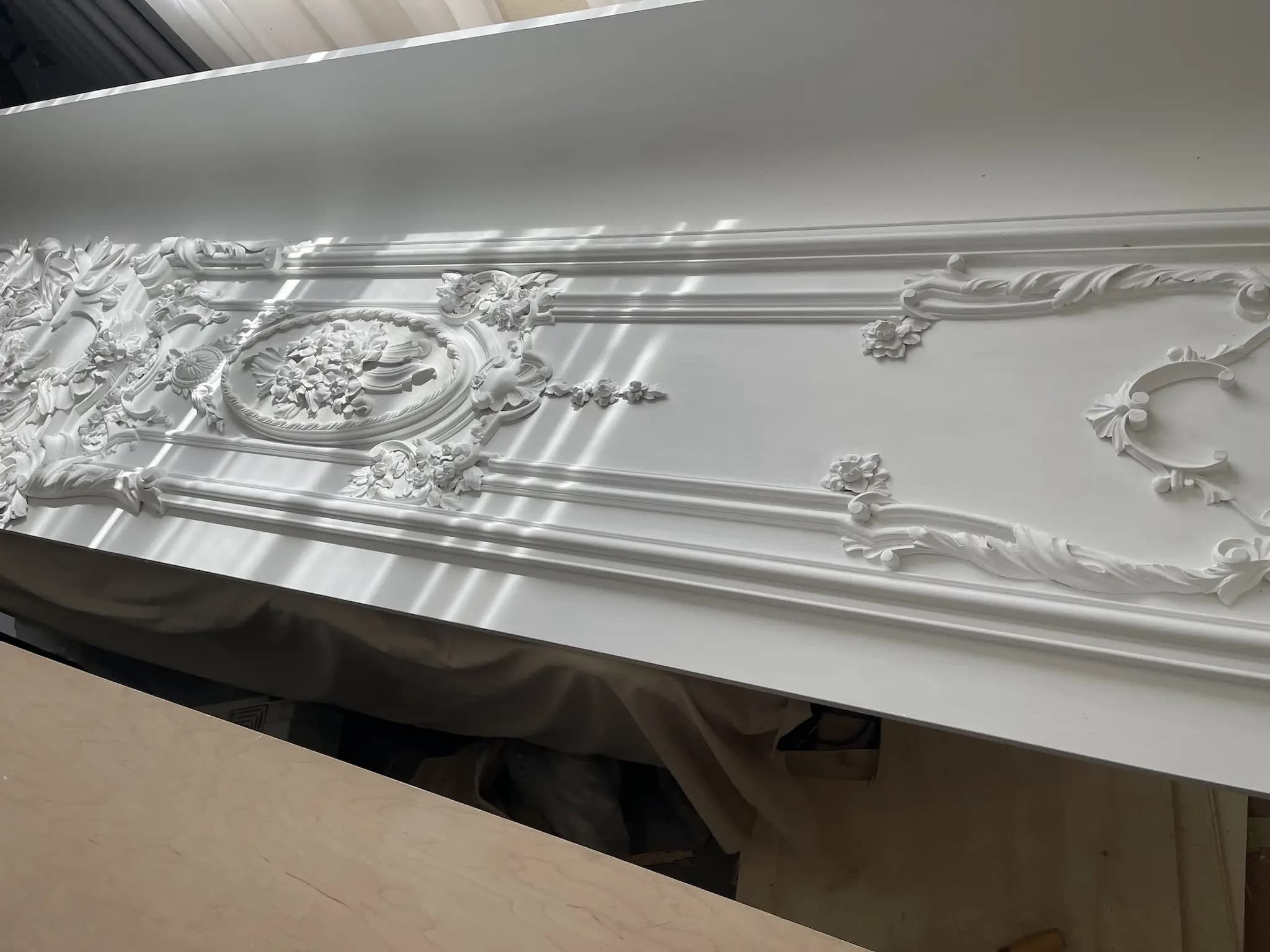 Rococo Floral Panel with Central Medallion White-finished Rococo wood panel with floral medallion and scrollwork, a custom wood carving by Alexander Grabovetskiy.