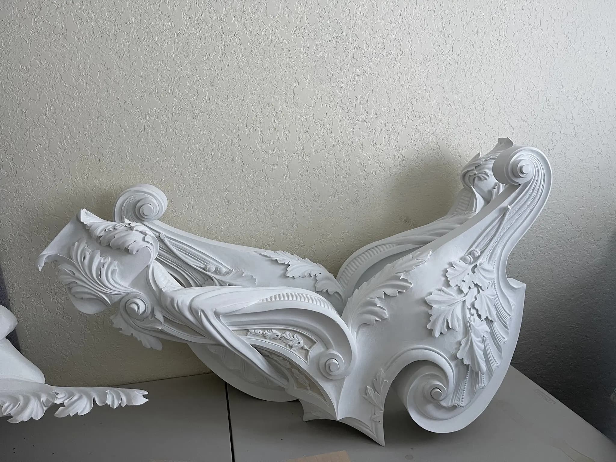 Rococo Acanthus Scroll Cartouche Symmetrical Rococo acanthus scroll cartouche hand-carved by Alexander Grabovetskiy, a custom wood carving with white primed finish.