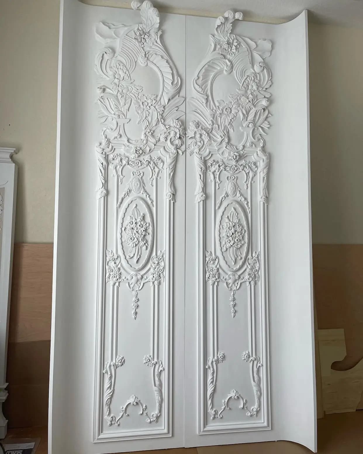 Rococo Carved Door Panels with Floral Cartouches Pair of white Rococo carved wood door panels with floral cartouches by Alexander Grabovetskiy, a custom wood carving.