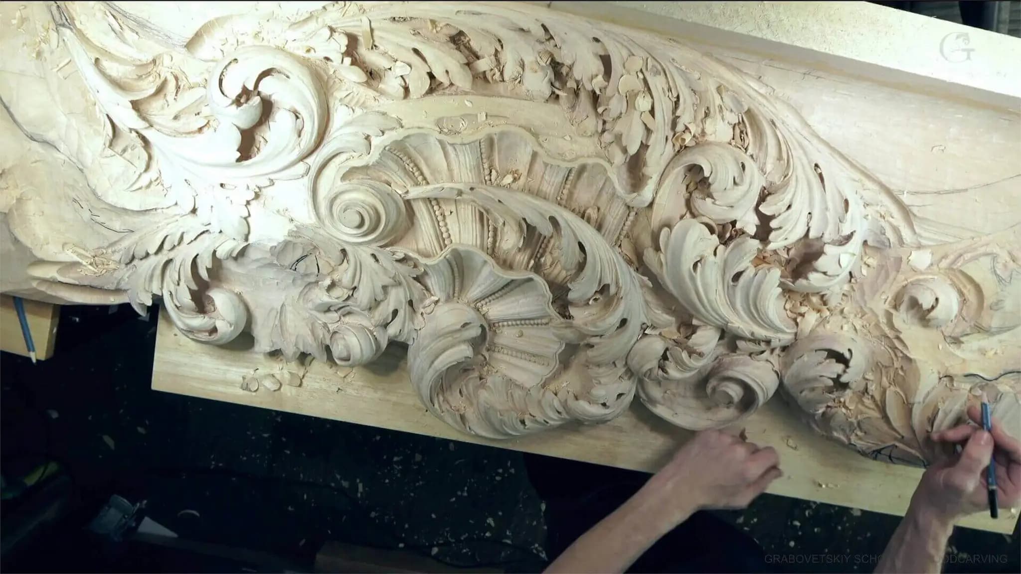 Baroque Shell and Acanthus Frieze Alexander Grabovetskiy hand-shaping a Baroque shell and acanthus frieze as custom wood carving on his bench.
