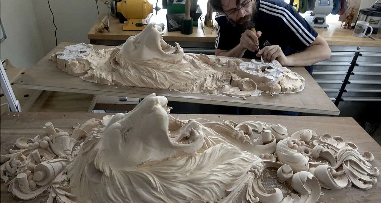Carved Lion Heads with Foliage Scrolls Alexander Grabovetskiy carving a pair of limewood lion heads in this custom wood carving in his studio.